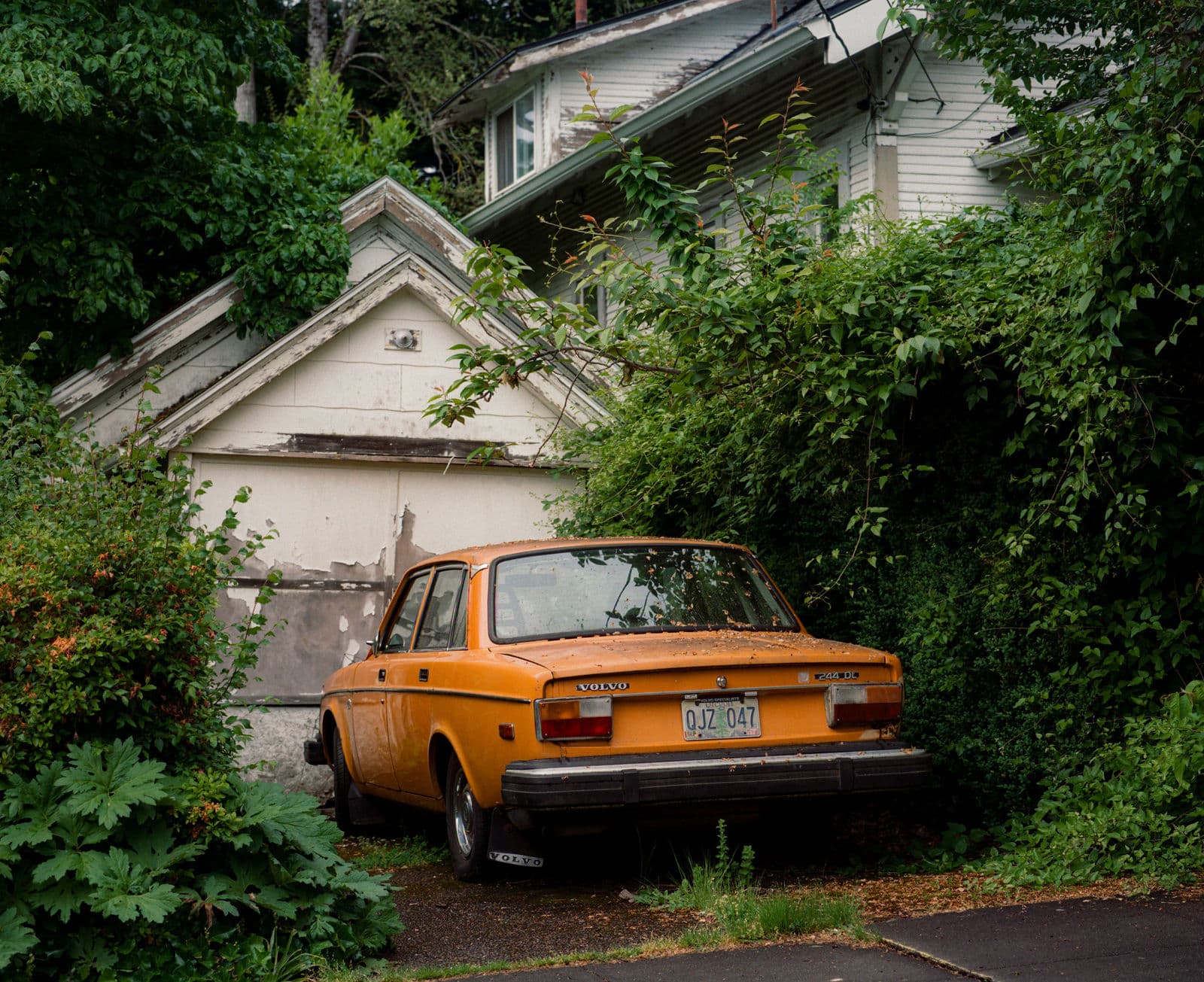 Vintage orange Volvo parked on a residential driveway — Kyle Nolan Photography, Los Angeles